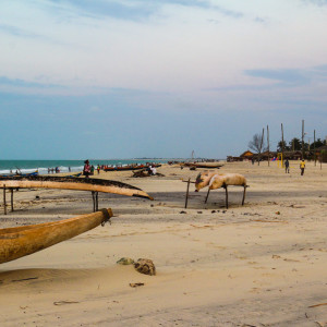 Local fishing boats scatter the beach