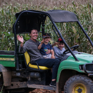 The charismatic William driving Anni and his brother around the farm